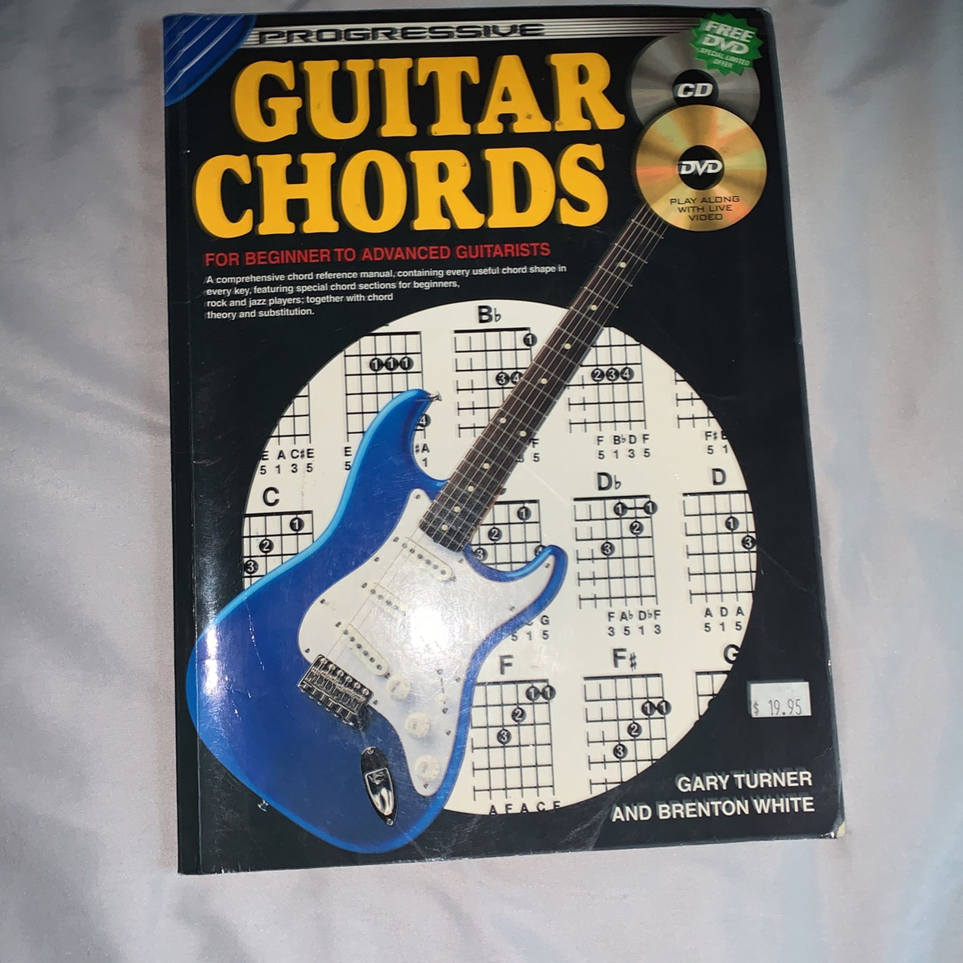electric guitar with basic chords book