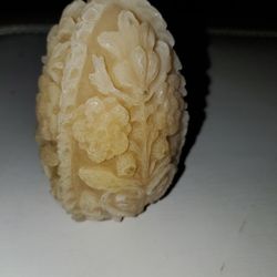 Hand Carved candle with a floral design.  Stands 4in tall and 2.5in wide. 