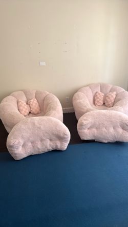 2 pink cushion chairs