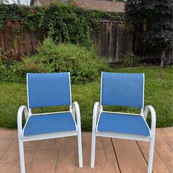 2 outdoor stackable chairs