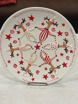 White ceramic Roman Inc. large holiday plate featuring dancing reindeer. 13.5”