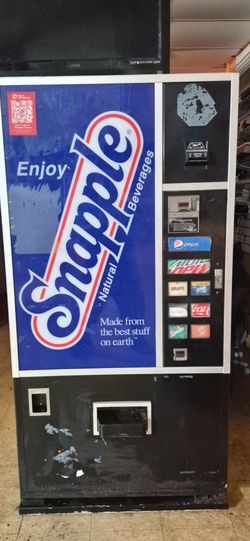 Soda machine accepts dollars or change with 2 sets of keys