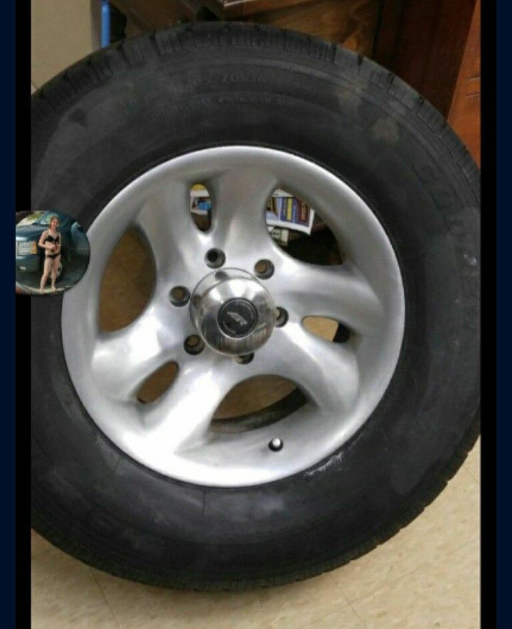 Two Sets Of Rims One Chevy And One After Market