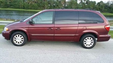 2003 Chrysler Town and Country minivan strong engine needs transmission work.
