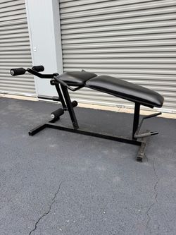 Leg extension and curl machine