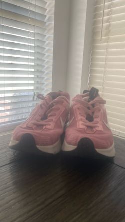 Nike pink and white shoes