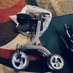       $125-Foldable senior Walking apparatus with Seat and Four big Wheels- (well loved as you can see as it has some discoloration from use on back b