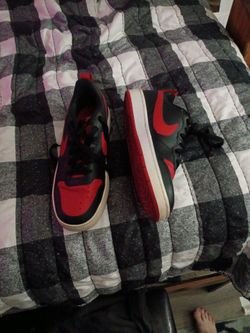 Red and black nikes