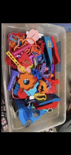 Large assortment of cookie cutters and Play-Doh vacuum cleaner
