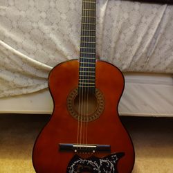 Guitar And Black Carrying bag With Accessories 