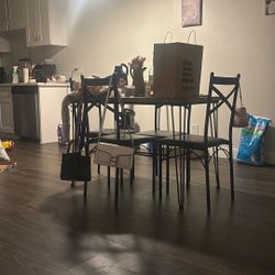 wooden table with four chairs