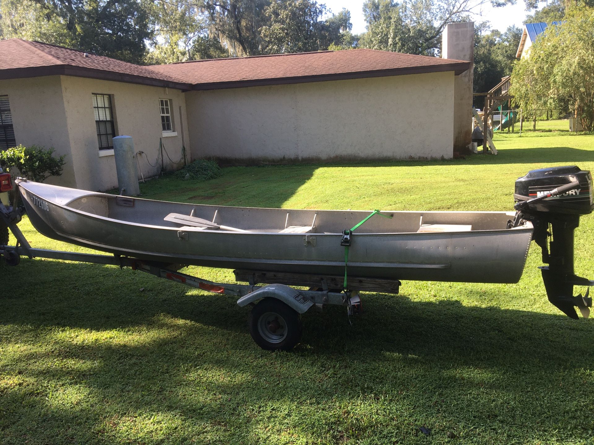 15’ Gruman aluminum Gheenoe with early 1990’s model 9.9 Mercury. Good