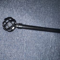 decorative curtain rod with cage-style finials