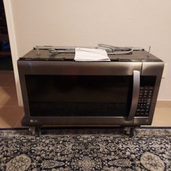 LG OVER THE RANGE  MICROWAVE  COMPLETE WITH MOUNTING  HARDWARE AND  MANUAL  MAKE OFFER MUST SELL 