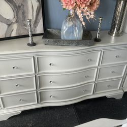 Light Grey Dresser With Decorative Knobs