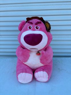 Disney Pixar Toy Story Lots-o'-Huggin' Bear plush toy featuring his signature strawberry pendant and grumpy expression