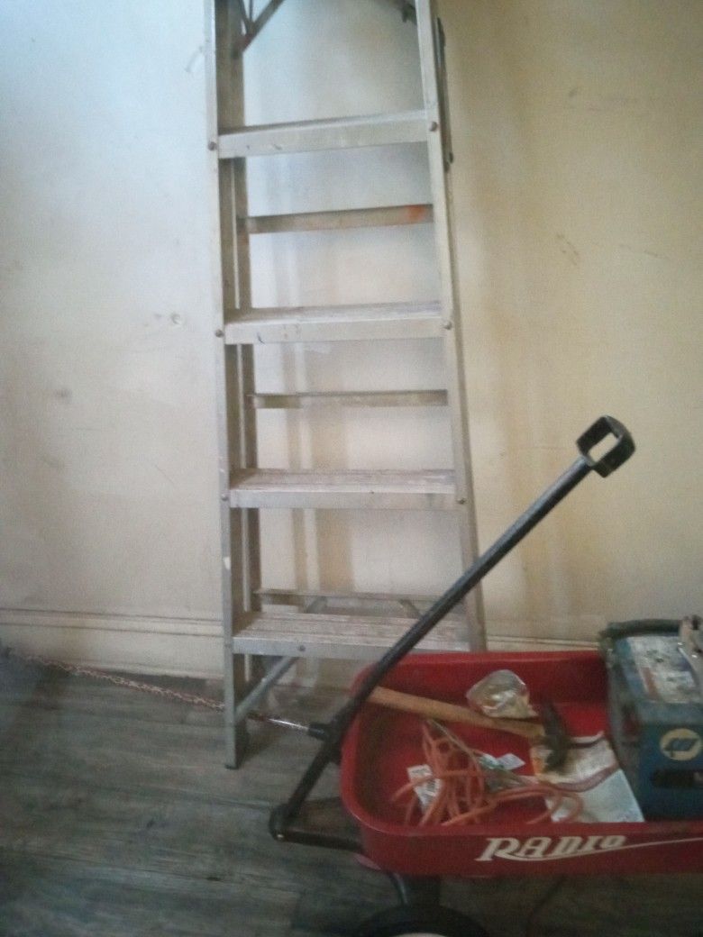 One Aluminum And One Fiberglass Ladder 6ft