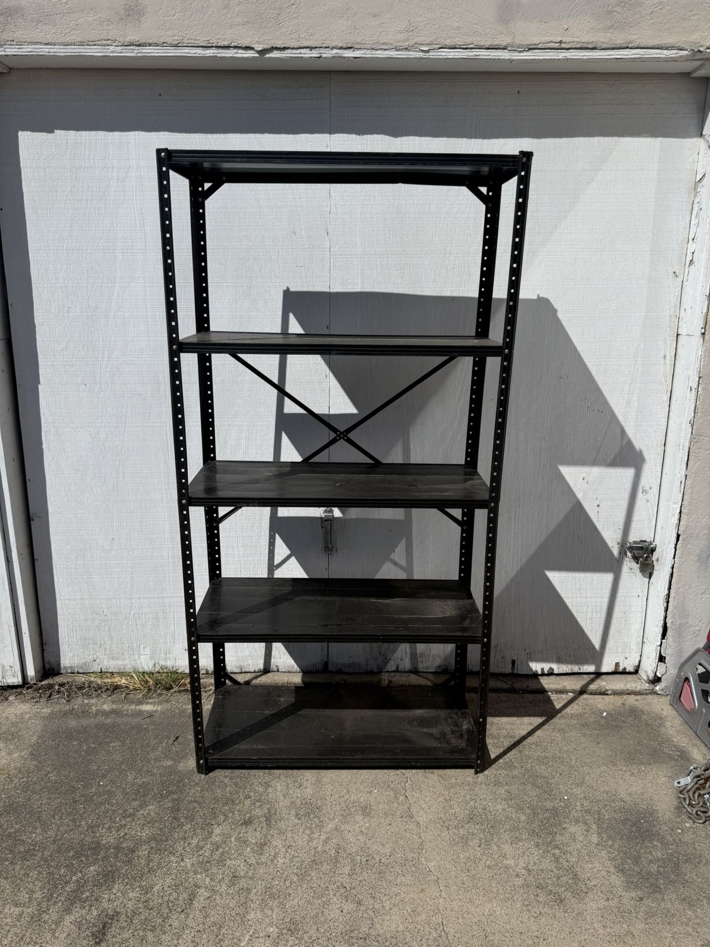Metal. Five shelves shelf for garage organizing totes. 
