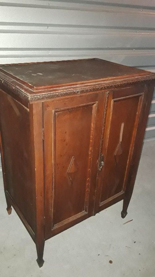 Antique dresser with doors that opens in the front as well as the back