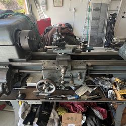 Logan small lathe with tooling and extra parts