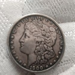 1900 Morgan Silver Dollar. 1922 Liberty Silver Dollar. Both $60