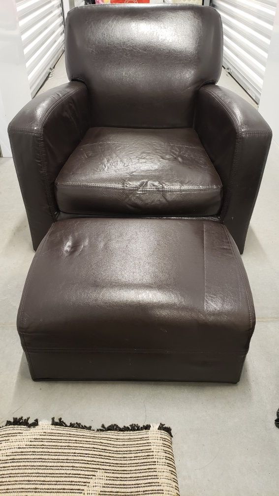 Brown leather chair and ottoman