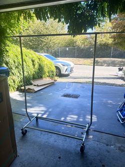 Folding metal rolling garment rack