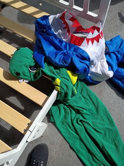 Three costumes one large dinosaur one shark and one small dinosaur asking 25 for all three