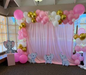 Baby Shower pink Elephants stands with pink curtain backdrop