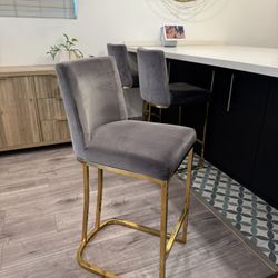 Set of 4 Gray Suede bar stools with Gold legs 