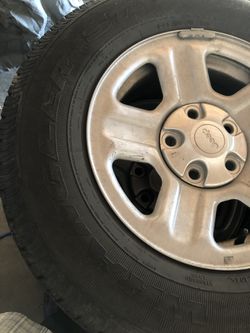 5 Jeep wheels and tires