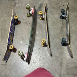 3 Skateboards And 1 Longboard 