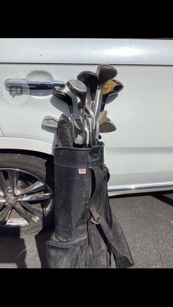 Vintage golf clubs and balls