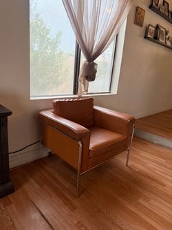 Two Tan Leather Club Chair with Chrome Frame