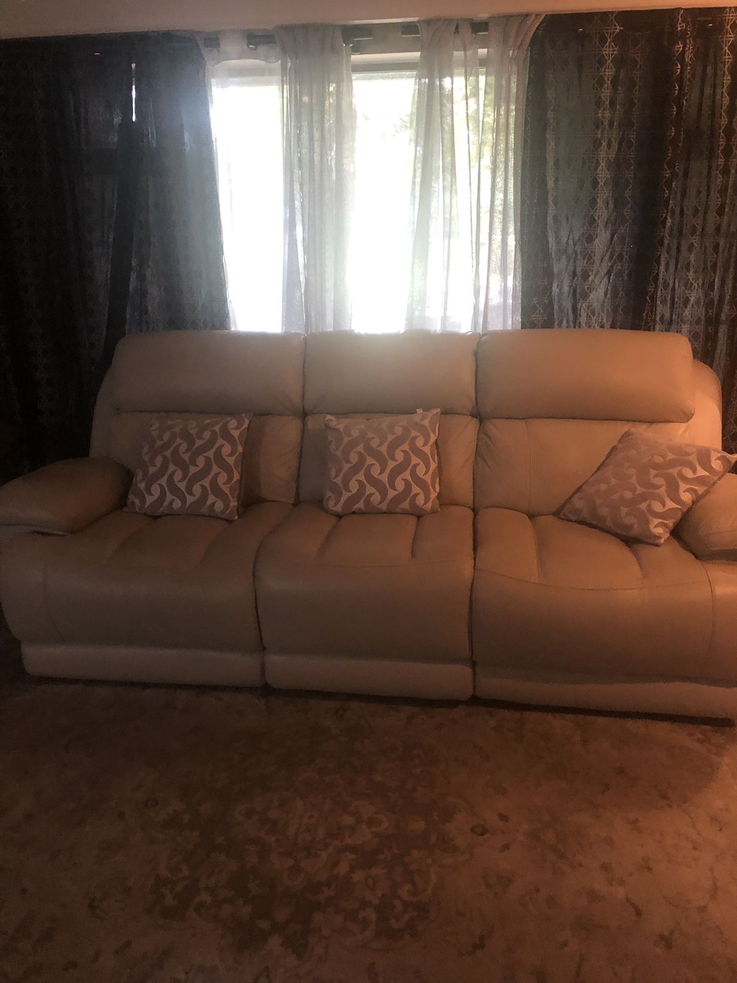 Leather recliner sofa with charging ports on both ends of recliner