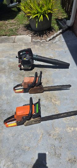 2 stihl chainsaws and a gas blower