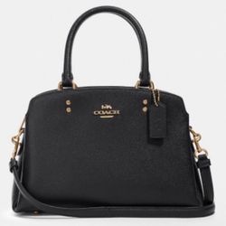 New Rarely Used Lillie Carryall Handbag Crossbody Leather Light Blush Black Coach Medium sized purse with 4 purse pockets 