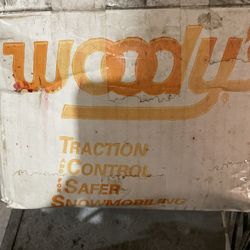 Snowmobile traction studs