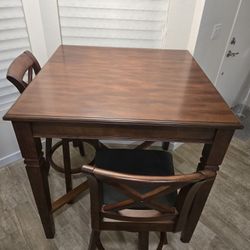 Dark wood counter height table and 6 bar stools