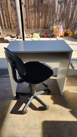 Desk and rolling chair