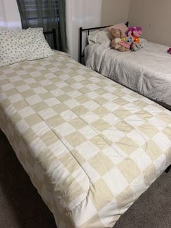 2 twin sized metal bed frames with mattress