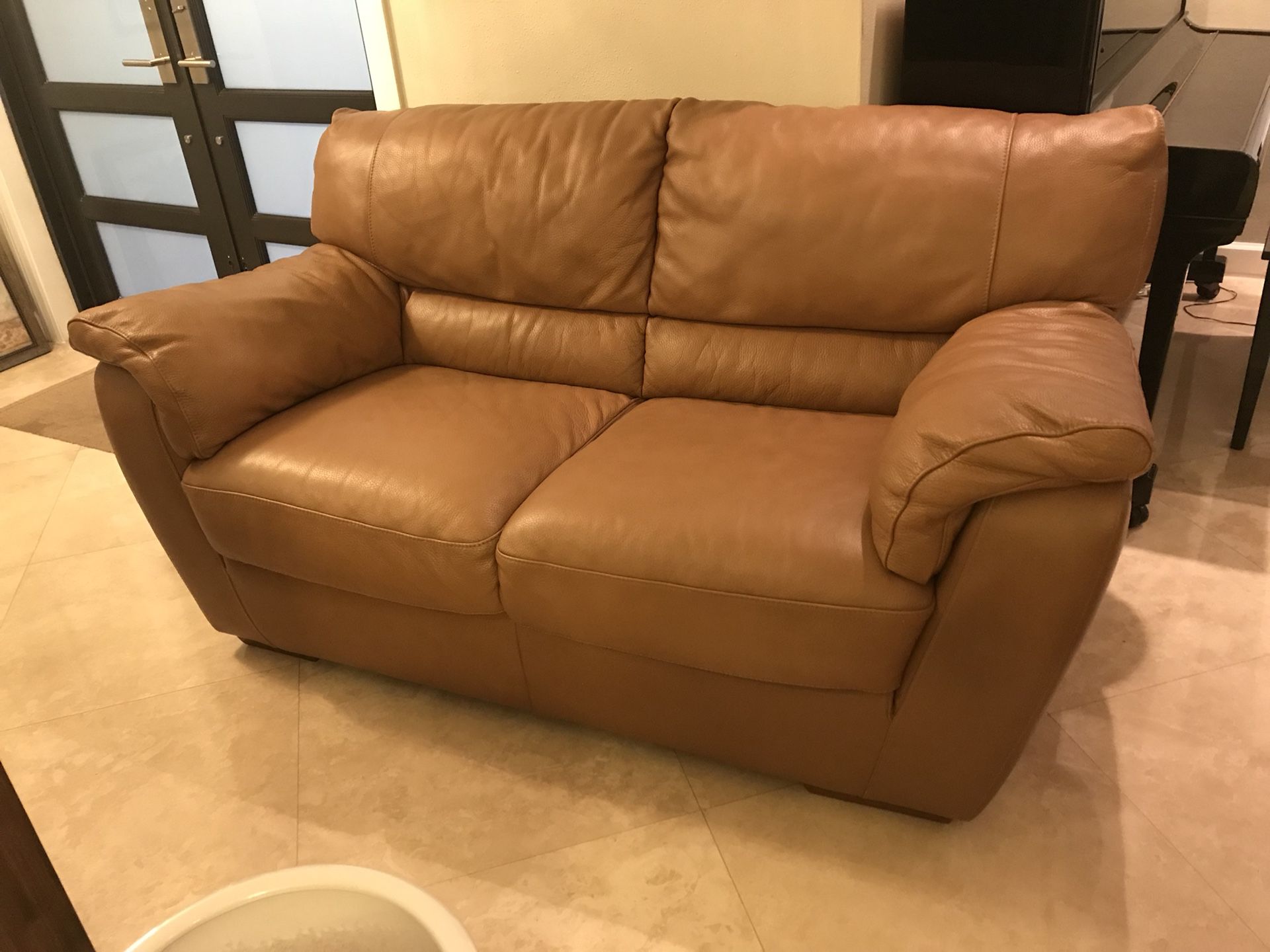 Natuzzi sofa and loveseat set Leather. Not reclining. will sell separate couch