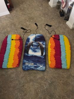 3 boogie boards- dolphin design 33 inches long and 2 - 33 inches long multi colored