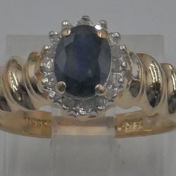 14KT YELLOW GOLD RING WITH OVAL SAPPHIRE AND 16 DIAMONDS 0.25CARAT SIZE 6.5 MINT 865666-1.