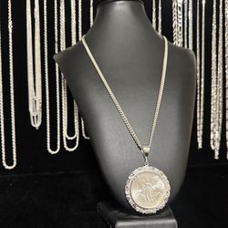 Silver Cuban chain with silver centenario available in nugget bezel , Versace , and rope