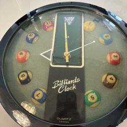 A vintage 10-inch wall clock featuring a pool table motif with miniature numbered billiard balls as hour markers.
