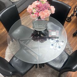 Glass top table and 4 chairs