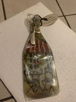 Unopened wine bottle shaped cheese tray