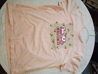 Coach t-shirt looks beige size large