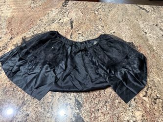 Girls or women’s Halloween CAPLET small cape it does have some sparkly dots on the sheer netting part of the fabric overlay.